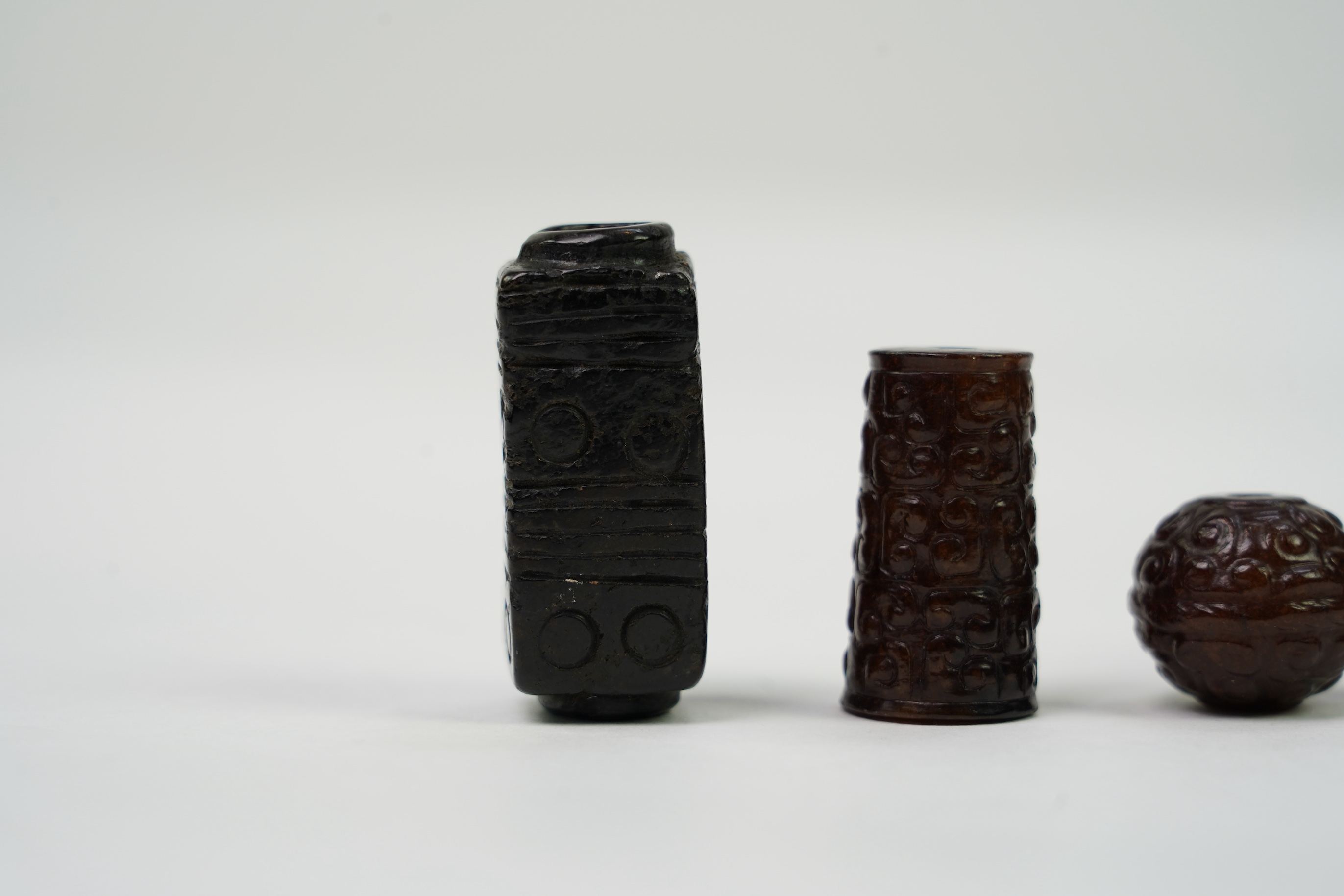 A group of four Chinese archaistic jade beads